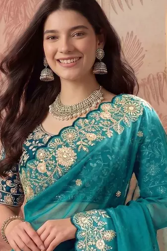 Teal embellished embroidered poly georgette saree