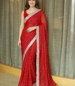 Red ethnic motifs sequinned satin saree
