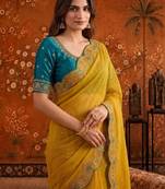 Yellow women embellished embroidered saree