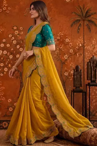 Yellow women embellished embroidered saree