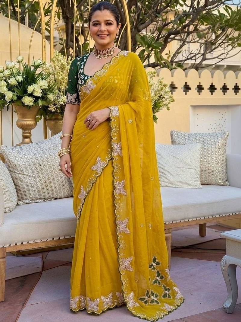Yellow women ethnic motifs embroidered  georgette saree