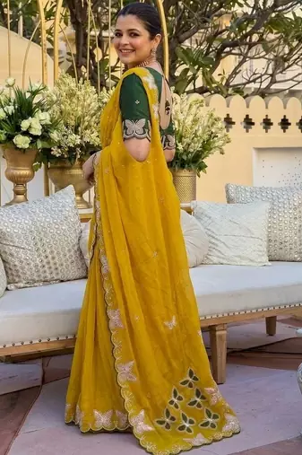 Yellow women ethnic motifs embroidered  georgette saree