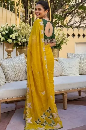 Yellow women ethnic motifs embroidered  georgette saree