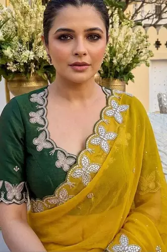 Yellow women ethnic motifs embroidered  georgette saree