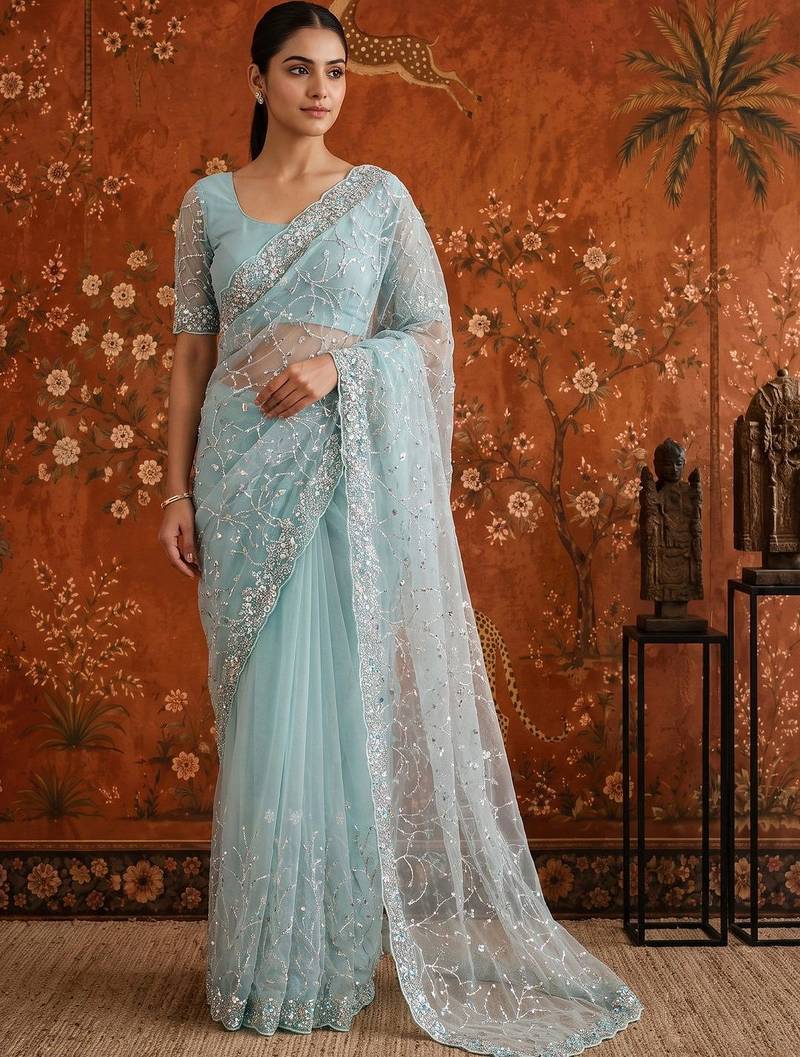 Turquoise women embellished beads and stones net fusion saree