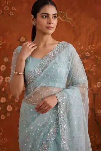 Turquoise women embellished beads and stones net fusion saree