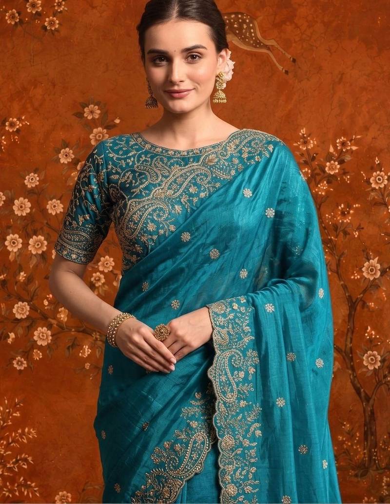 Teal embellished embroidered satin saree