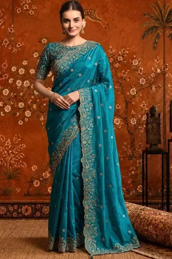 Teal embellished embroidered satin saree