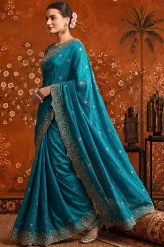 Teal embellished embroidered satin saree