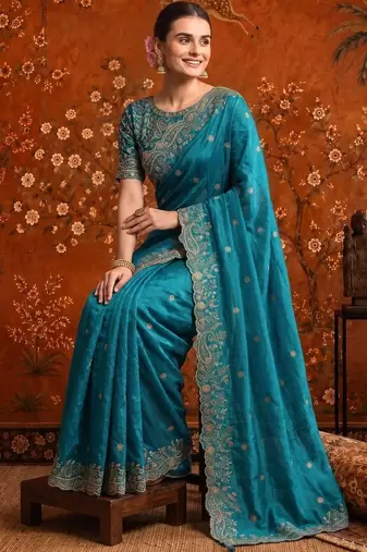 Teal embellished embroidered satin saree