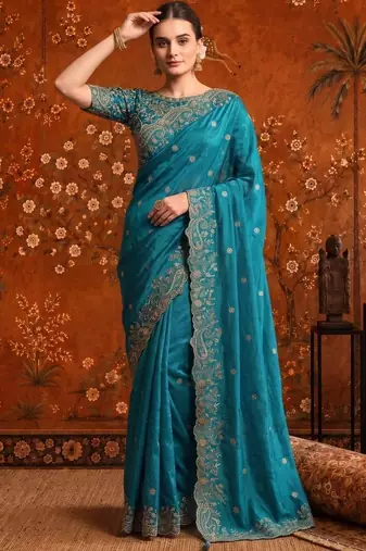 Teal embellished embroidered satin saree