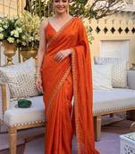 Orange ethnic motifs sequinned satin saree