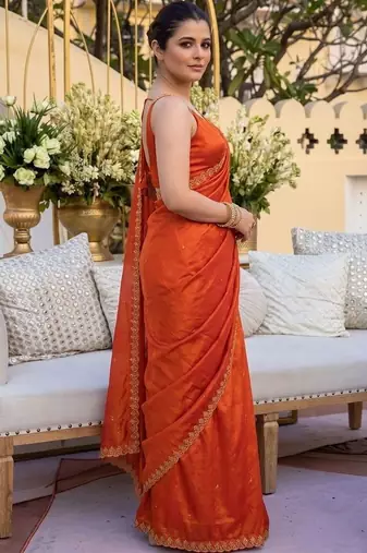 Orange ethnic motifs sequinned satin saree