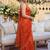 Orange ethnic motifs sequinned satin saree