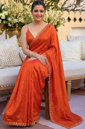 Orange ethnic motifs sequinned satin saree