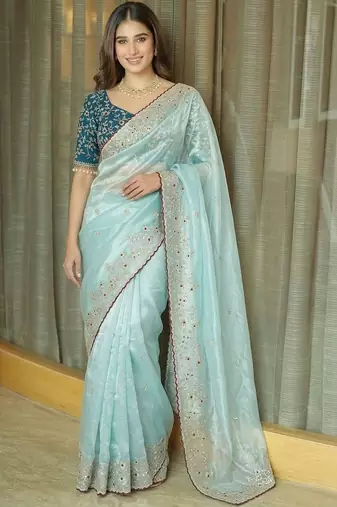 Turquoise embellished embroidered tissue saree