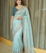 Turquoise embellished embroidered tissue saree