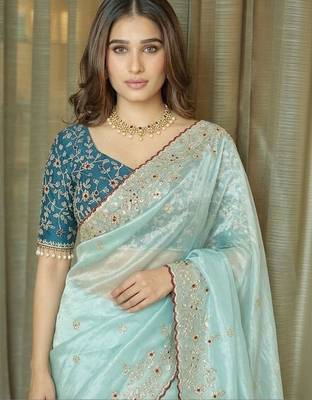 Turquoise embellished embroidered tissue saree 4