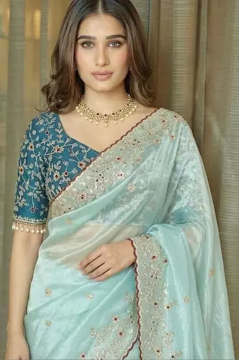 Turquoise embellished embroidered tissue saree