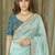 Turquoise embellished embroidered tissue saree
