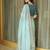 Turquoise embellished embroidered tissue saree