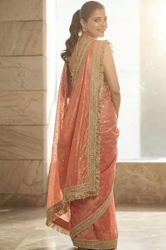 Peach embellished embroidered sequinned sarees with unstitched blouse piece