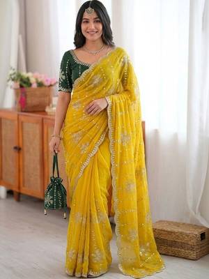 Yellow ethnic motifs sequinned  georgette saree 1