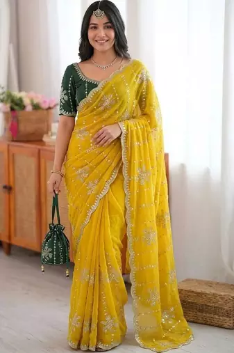 Yellow ethnic motifs sequinned  georgette saree