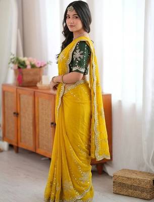 Yellow ethnic motifs sequinned  georgette saree 2