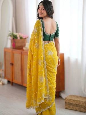 Yellow ethnic motifs sequinned  georgette saree 3