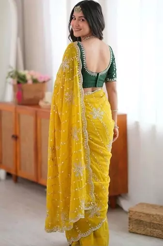 Yellow ethnic motifs sequinned  georgette saree