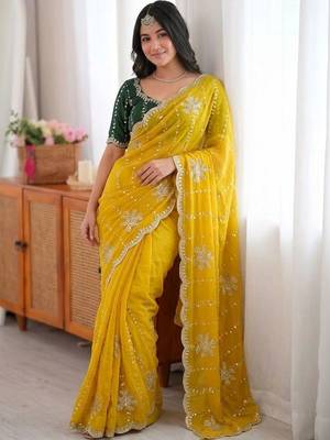 Yellow ethnic motifs sequinned  georgette saree 4