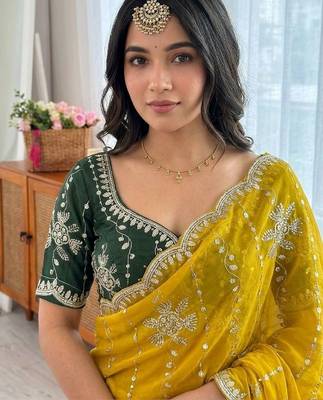 Yellow ethnic motifs sequinned  georgette saree 5