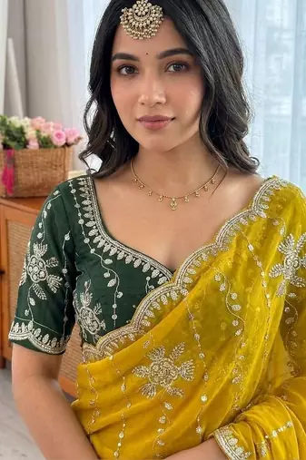Yellow ethnic motifs sequinned  georgette saree