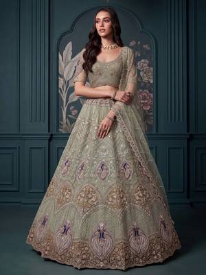 Luxurious Pista Green Hand Work Net Reception Wear Lehenga Choli With Dupatta 1