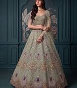 Luxurious Pista Green Hand Work Net Reception Wear Lehenga Choli With Dupatta