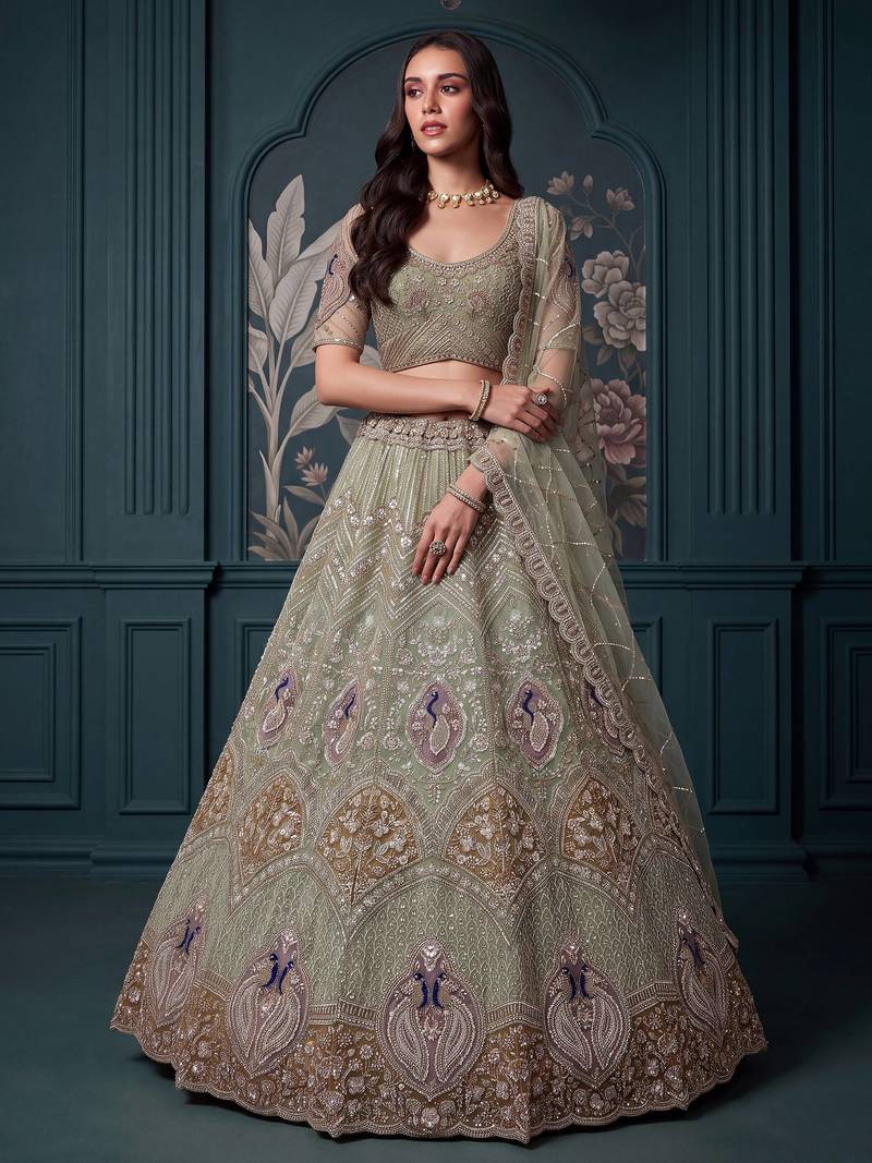 Luxurious Pista Green Hand Work Net Reception Wear Lehenga Choli With Dupatta