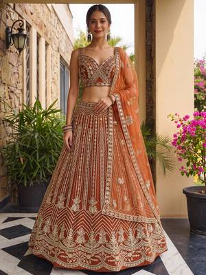 Grand Orange Heavy Embroidered Net Reception Wear Lehenga Choli 1