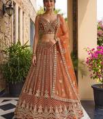 Grand Orange Heavy Embroidered Net Reception Wear Lehenga Choli