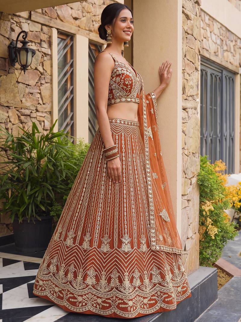 Grand Orange Heavy Embroidered Net Reception Wear Lehenga Choli