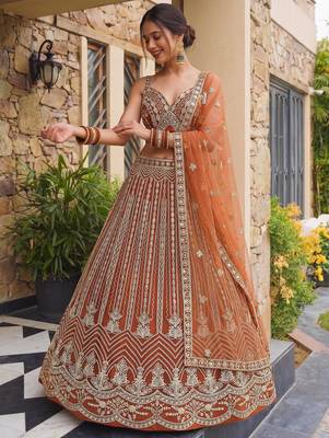 Grand Orange Heavy Embroidered Net Reception Wear Lehenga Choli 3