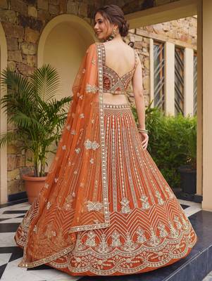 Grand Orange Heavy Embroidered Net Reception Wear Lehenga Choli 4