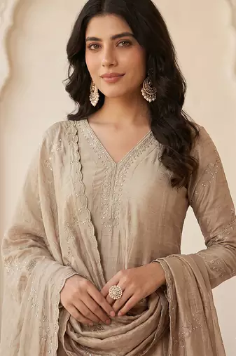 Classy beige heavy embroidered flared kurti with pant & dupatta set