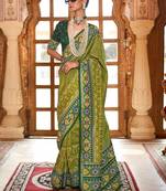 Green ethnic motifs zari patola saree