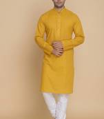 yellow cotton men's kurta with white churidar pajama