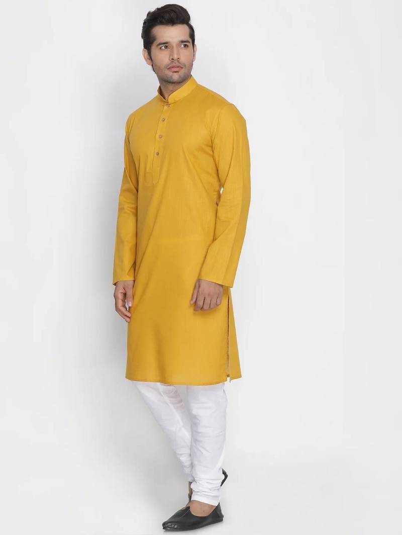 yellow cotton men's kurta with white churidar pajama