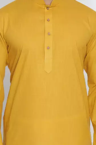 yellow cotton men's kurta with white churidar pajama
