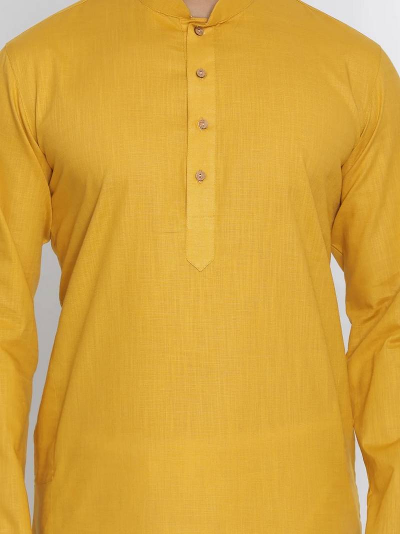 yellow cotton men's kurta with white churidar pajama