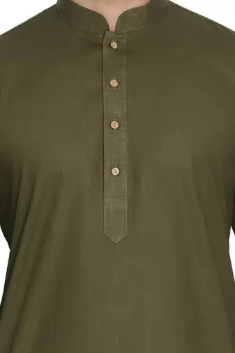 green cotton men's kurta with white churidar pajama