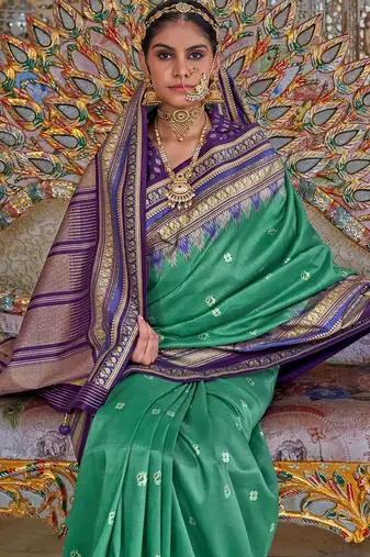 Teal ethnic motifs printed zari sungudi saree